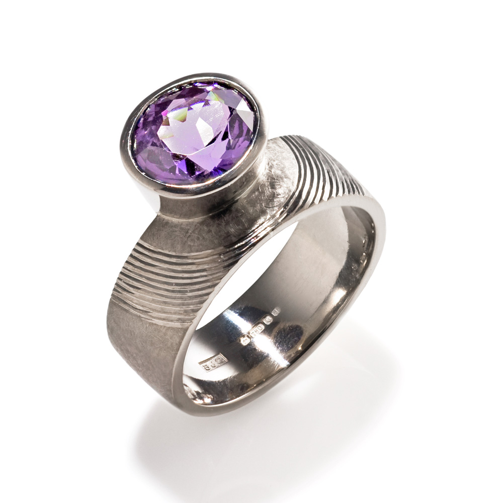 <a href="/jewellery/ring-1">Dress Ring, 2008. 18 ct white gold, shank hand engraved, set with oval cut mauve spinel. Photo : Simon Armitt</a>