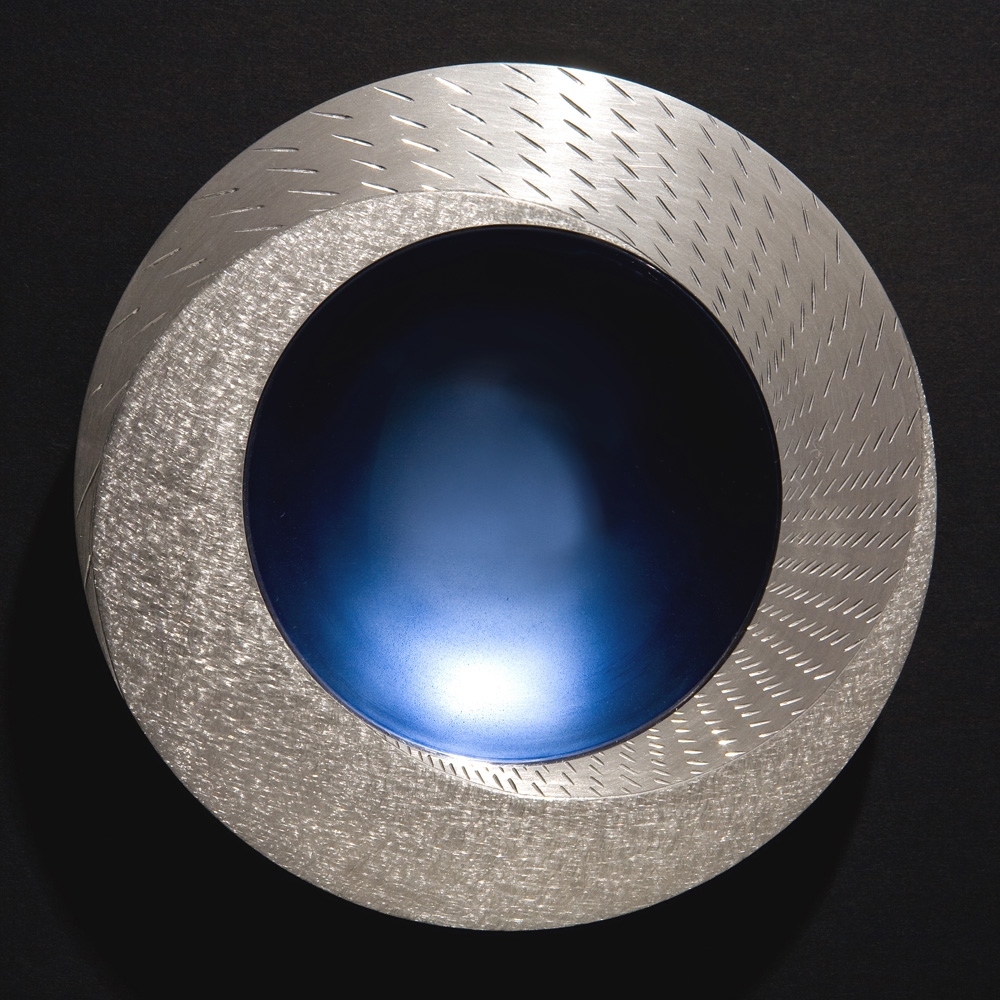 <a href="/jewellery/rain-spinning-bowl-2008-150-mm-diameter-brittannia-silver-moonstone-blue-enamel-white">RAIN SPINNING BOWL 2008. 150 mm diameter. Brittannia Silver, Moonstone Blue enamel, white marble. Photo: Simon Armitt</a>